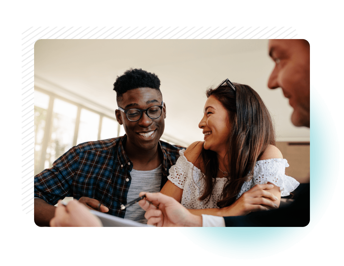 Smiling woman shaking hands with man in red sweater