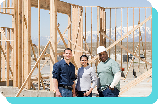 New homeowners with construction crew member