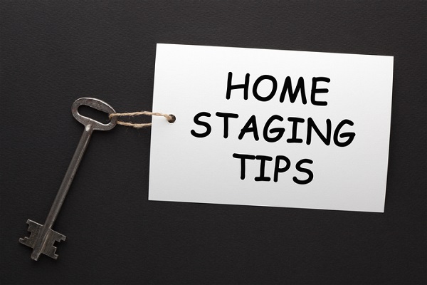 A skeleton key with a message attached that says Home Staging Tips