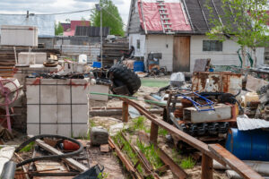 A mess in the yard. View of the courtyard cluttered with belongings.