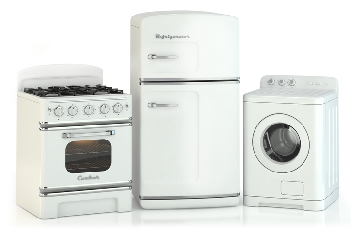 A retro Oven, refrigerator, and washing machine lined up next to each other, isolated on white background