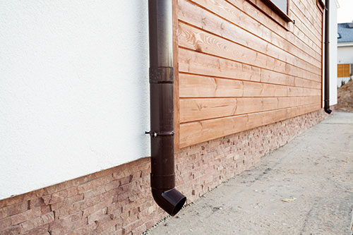 The siding of a house, including wood and stone