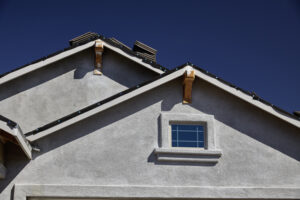 New home construction double gable roof and stucco exterior siding