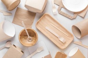 An assortment of bamboo kitchenware, such as forks, spoons, and bowls