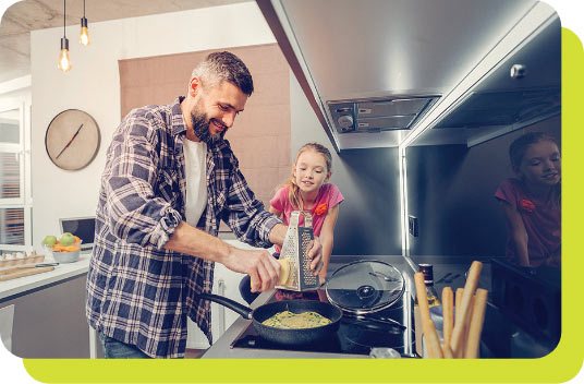 Father cooking for daughter