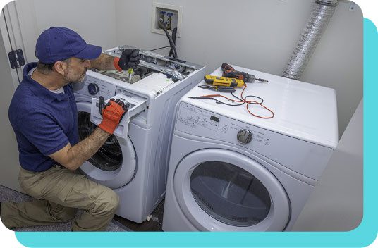 Repairman working on washing machine