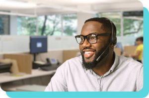 a man with a beard and headset smiling
