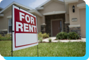 a home with a For Rent sign in front of it.