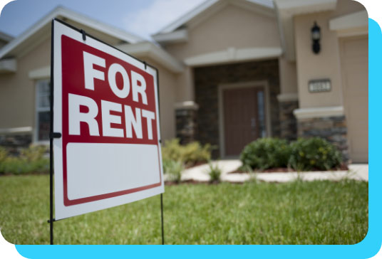 a home with a For Rent sign in front of it.