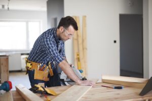 A carpenter cutting wood