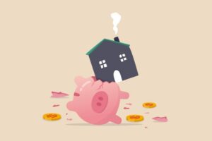 A drawing of a pink piggy bank on its side with three coin around it. There's a house on top of the piggy bank, and it has smashed open the side of it. Everything is on a tan background,