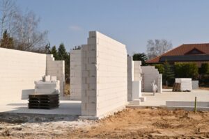 Construction site of a family house. Bare brickwork of a small home in the suburbs.