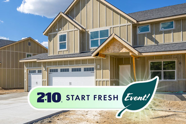 A newly-built house with a white garage door on the left and dirt where the grass will eventually be with the words 2-10 Start Fresh Event in a rounded button on the lower half. The word "Event" appears in a leaf.