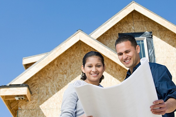 Couple looking at a new home maintenance blueprint