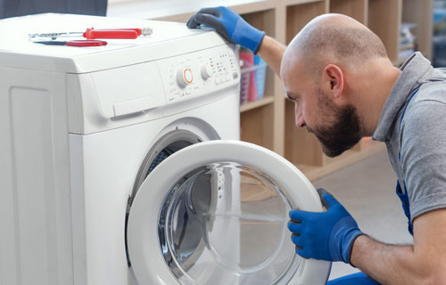 Contractor diagnosing broken washer